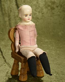 15" Wax over paper mache girl with cobalt glass eyes on German pink cloth body with stamp.