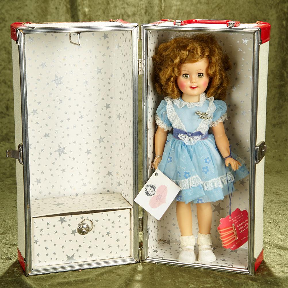 14.5" Vintage 1950's vinyl Shirley Temple in near mint condition with original tags and trunk.