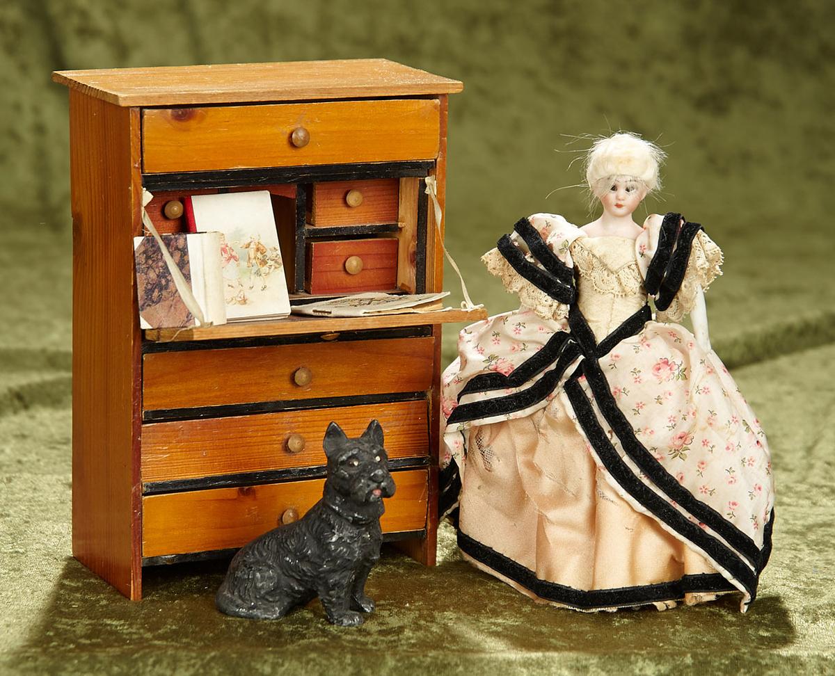 7" German bisque dollhouse lady by Simon & Halbig, with desk, books, and dog. $400/600