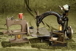 5-8.5" Three vintage and antique sewing machines including Wilcox & Gibbs and Singer.