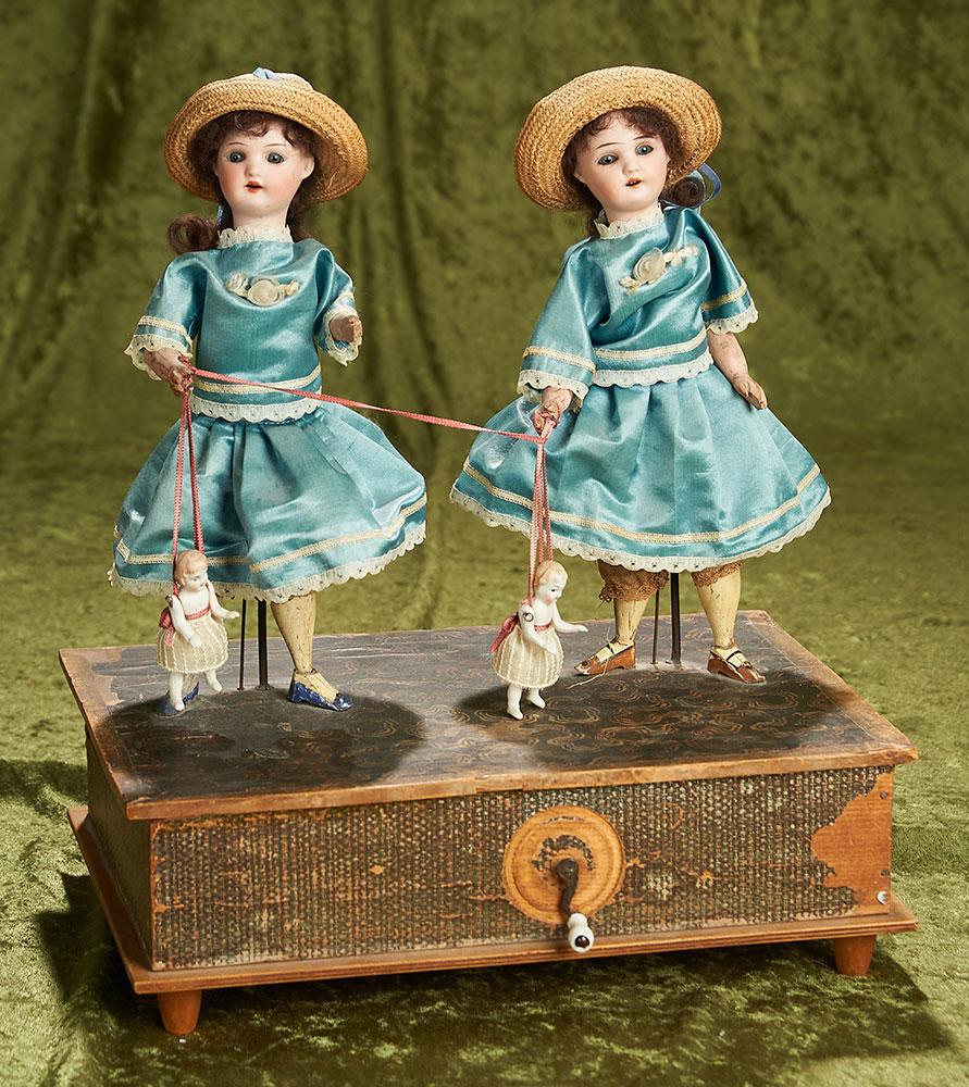 13"h. Sonneberg musical mechanical toy "Girls with Dancing Dolls" by Zinner and Sohne. $1300/1500