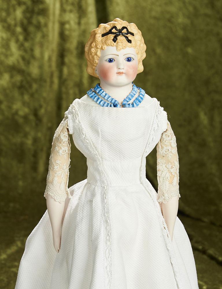 19" German bisque lady doll with rare sculpted hair, Dresden collar, and blue glass eyes. $1200/1500