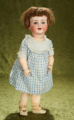 23" German bisque K*R 126 character child with a composition toddler body and sleep eyes