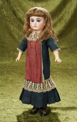 18" Sonneberg bisque closed mouth doll with large blue eyes. $700/900