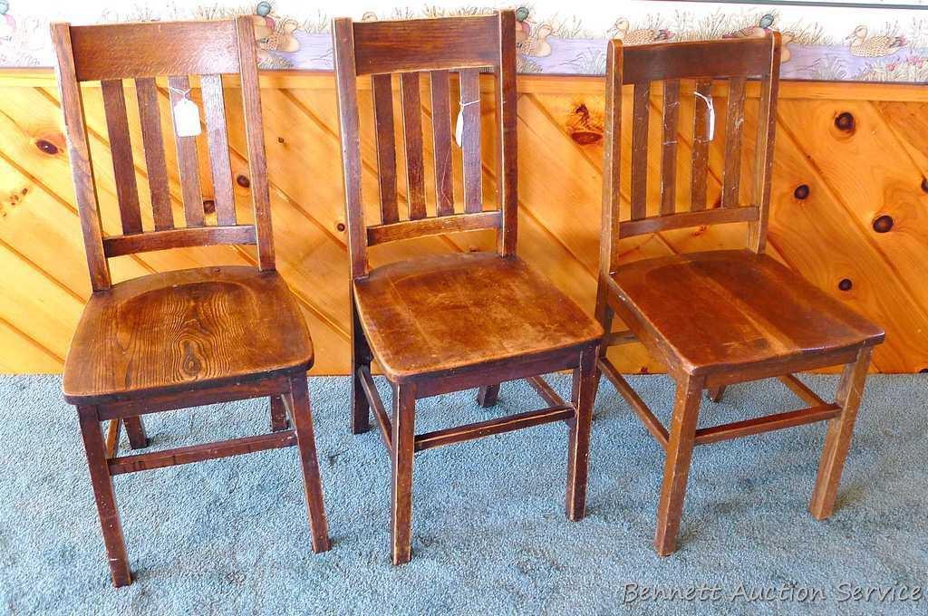 Three hardwood office chairs with iron braces are both sturdy and comfortable. Matches Lot #2 & 3.