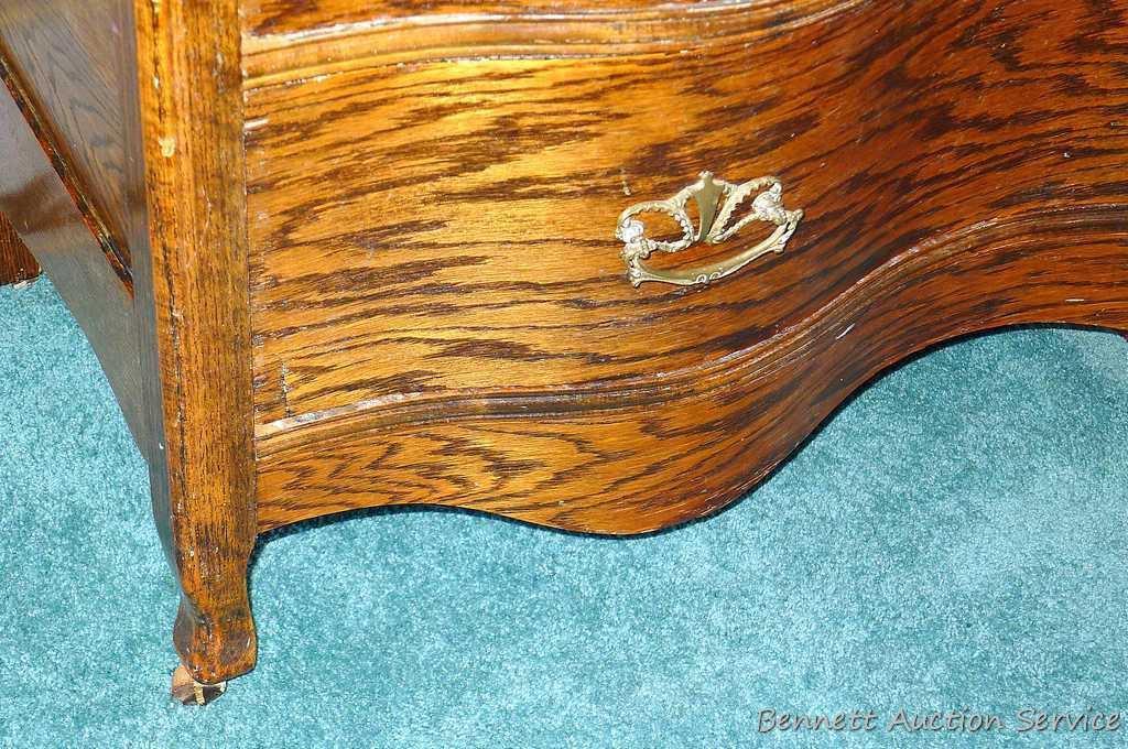 Antique serpentine four drawer dresser and wall mirror. Dresser is approx. 42-1/2" w x 19"d x 34" h.