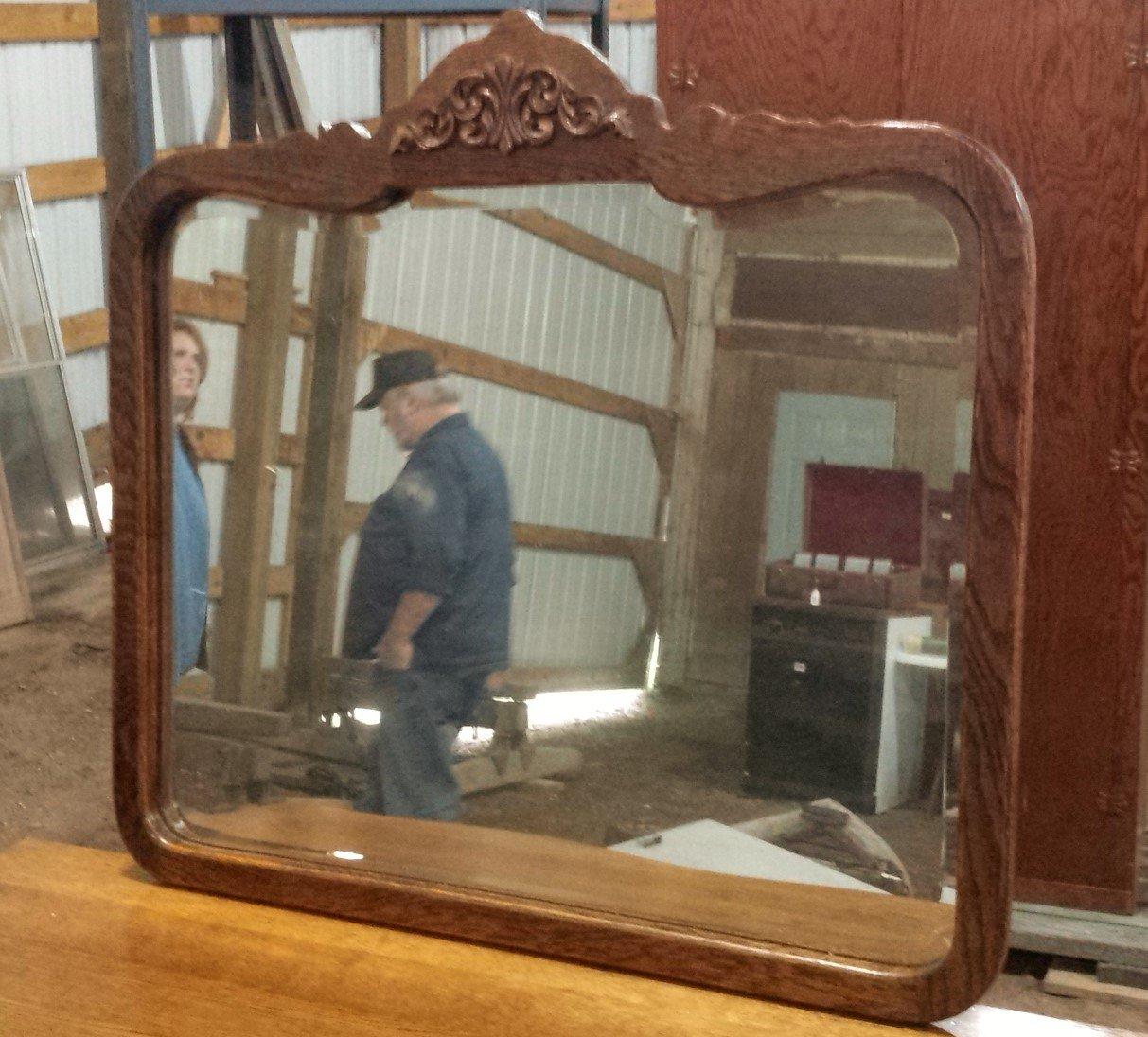 Antique serpentine four drawer dresser and wall mirror. Dresser is approx. 42-1/2" w x 19"d x 34" h.