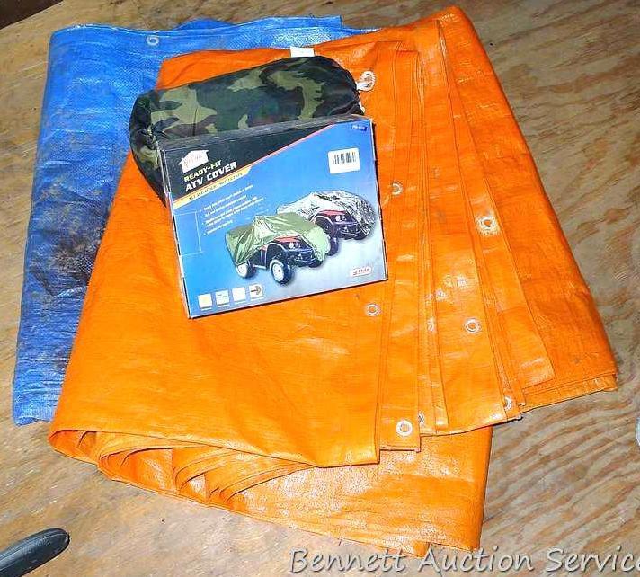 Camouflage ATV cover, plus two tarps in fair condition.