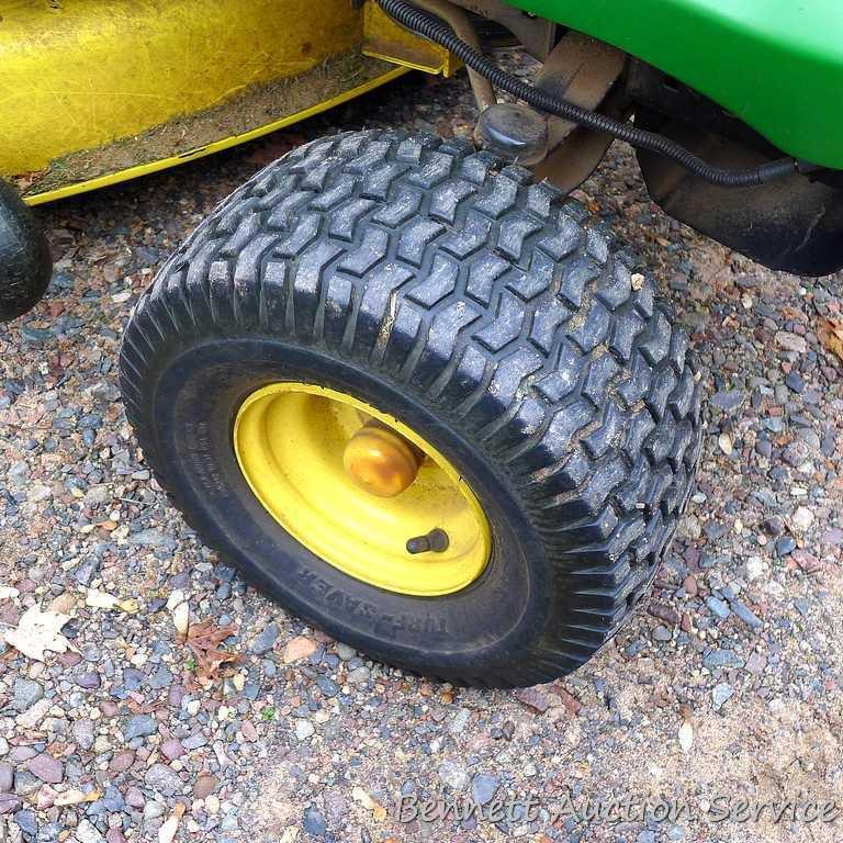 John Deere LA110 automatic hydrostatic lawn tractor with 42" mulching deck. Starts and runs fine.