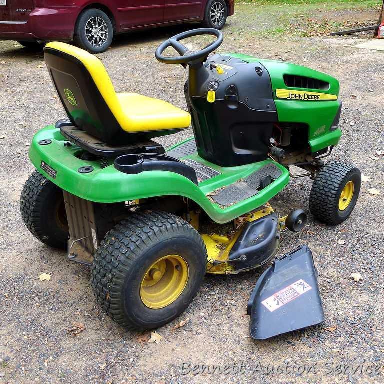 John Deere LA110 automatic hydrostatic lawn tractor with 42" mulching deck. Starts and runs fine.