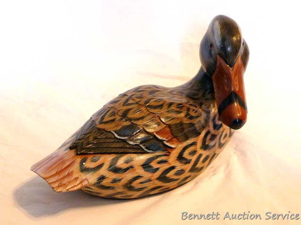 Carved wooden duck is approx. 12" long and in good condition with a couple of small chips.