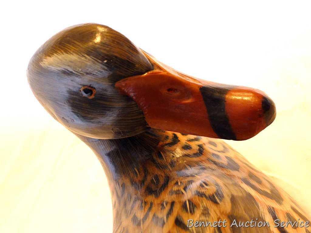 Carved wooden duck is approx. 12" long and in good condition with a couple of small chips.