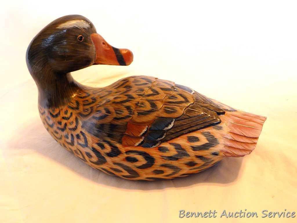 Carved wooden duck is approx. 12" long and in good condition with a couple of small chips.