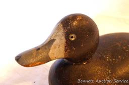 Antique wooden duck decoy with glass eyes is approx. 13" long and in overall nice condition. Great