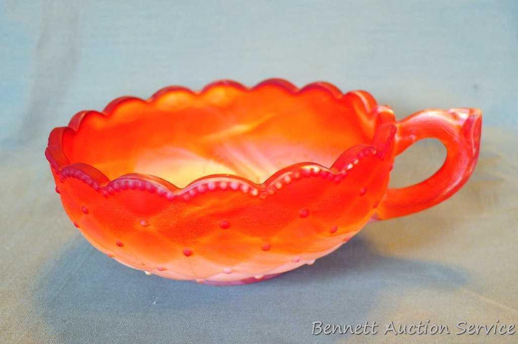Imperial Glass red slag glass 5-1/2" handled Poppy Nappy is in good condition with no cracks or