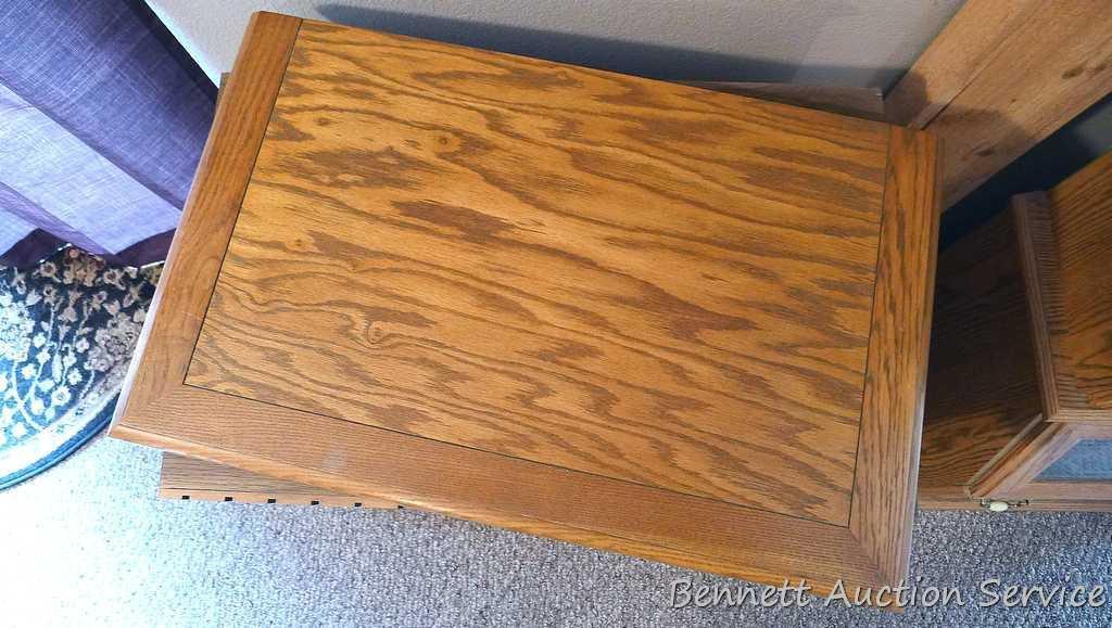 Swiveling TV stand is approx. 28" wide x 17" deep x 31" tall. Has a slide out shelf and storage