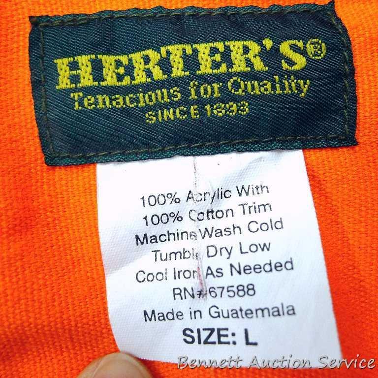 Blaze orange insulated hunting pants, size M; Herter's blaze orange shirt, size L; two caps. Hunting
