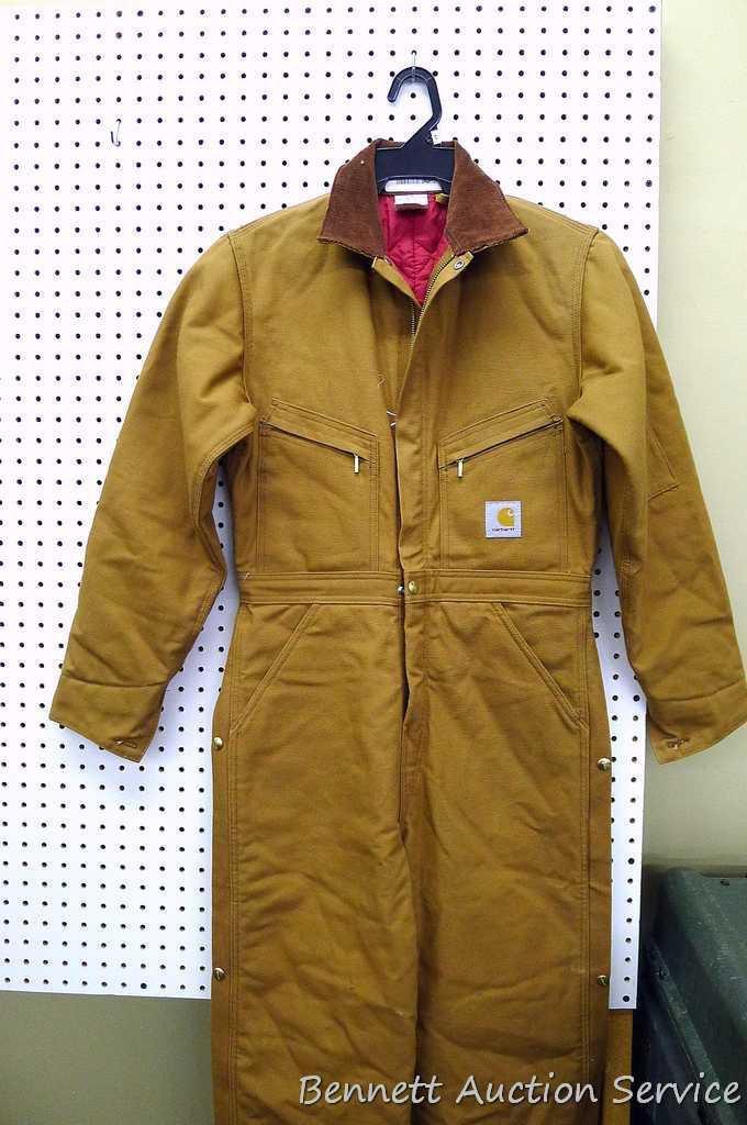 Carhartt insulated coveralls, 34 regular, appears new; two insulated hard hat liners.