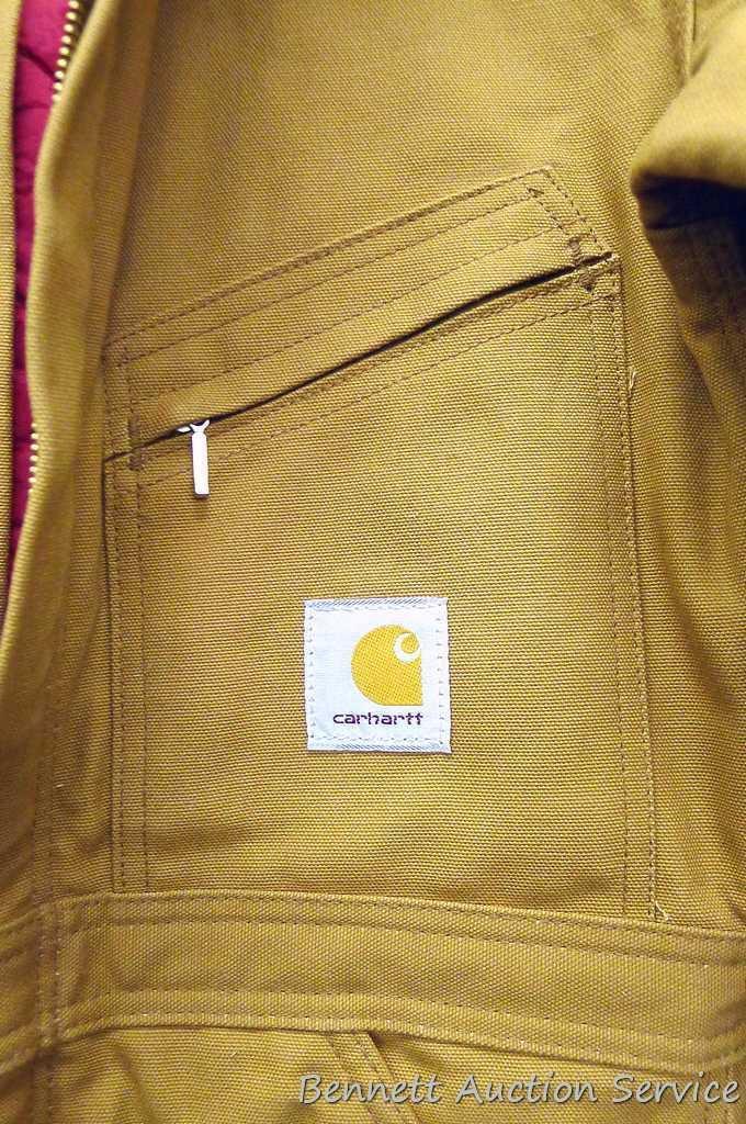 Carhartt insulated coveralls, 34 regular, appears new; two insulated hard hat liners.