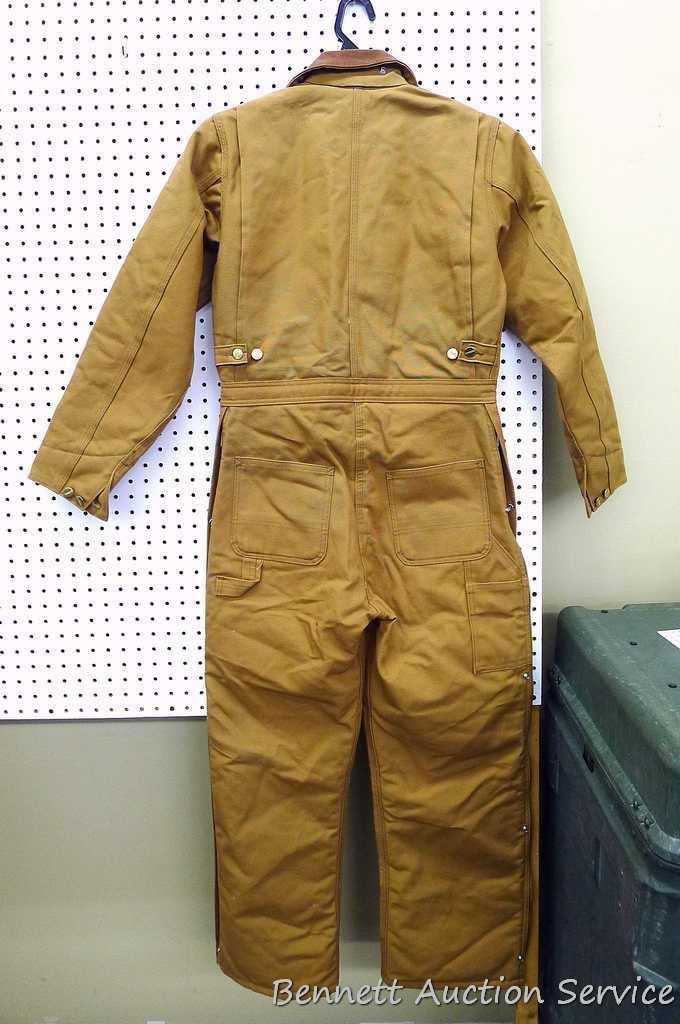 Carhartt insulated coveralls, 34 regular, appears new; two insulated hard hat liners.