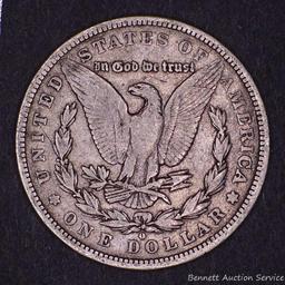 1879 O Morgan silver dollar.