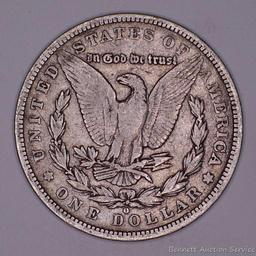 1879 O Morgan silver dollar.