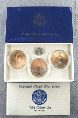 1984 P.D.S. uncirculated Olympic silver dollars.