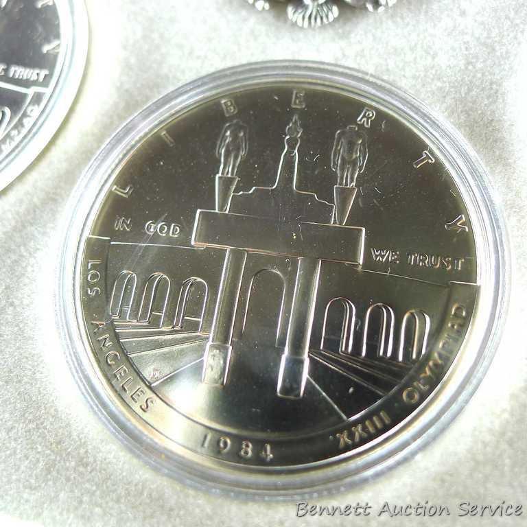 1984 P.D.S. uncirculated Olympic silver dollars.