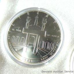 1984 P.D.S. uncirculated Olympic silver dollars.