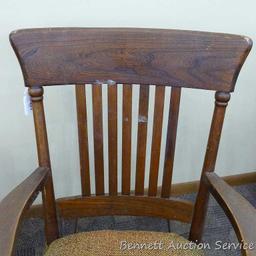 Sturdy vintage wooden rocking chair. Approx. 37" h x 21" deep (to back of chair). Cushion is springy