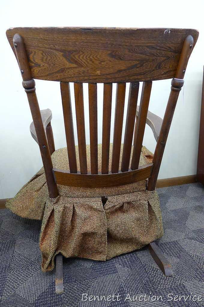 Sturdy vintage wooden rocking chair. Approx. 37" h x 21" deep (to back of chair). Cushion is springy