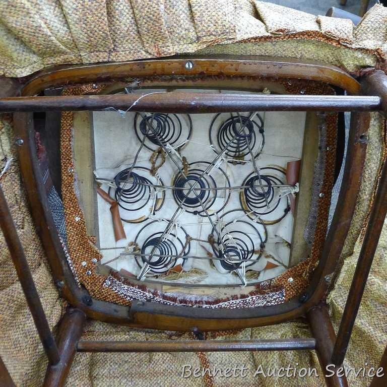 Sturdy vintage wooden rocking chair. Approx. 37" h x 21" deep (to back of chair). Cushion is springy