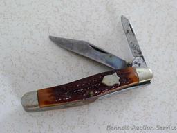 Classic pocket knife by Camillus of New York is 5-3/4" open. Handle slabs are in good condition.