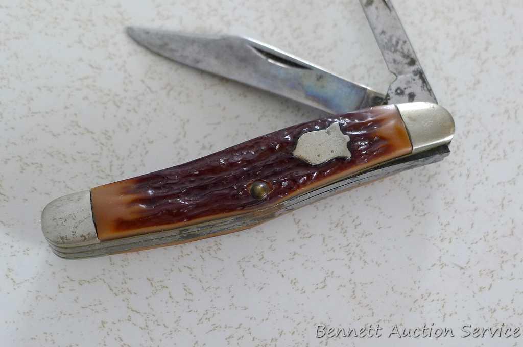 Classic pocket knife by Camillus of New York is 5-3/4" open. Handle slabs are in good condition.