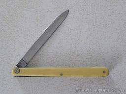 Unsharpened and unused promotional melon knife made in Germany by Murcott. 8-1/2" open. Advertises