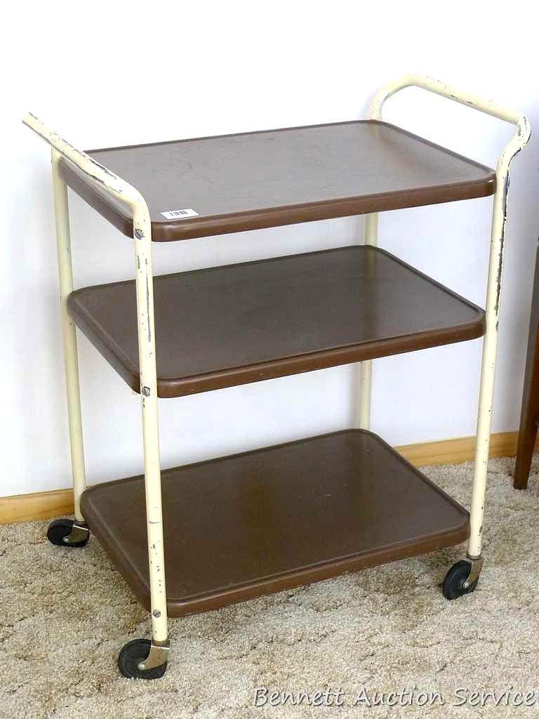 Vintage rolling kitchen cart is sturdy and in good shape. Some painted scratched off on handles,