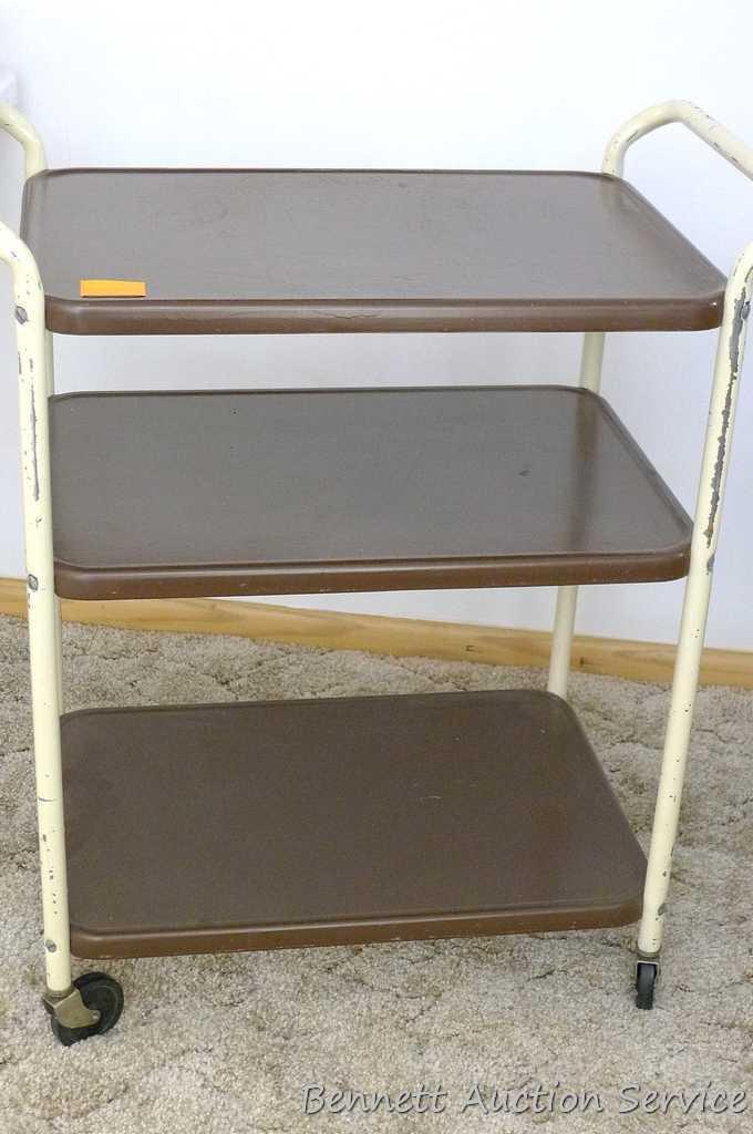 Vintage rolling kitchen cart is sturdy and in good shape. Some painted scratched off on handles,