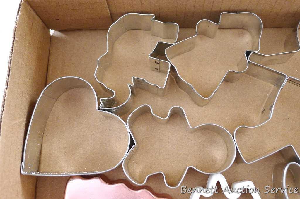 Vintage aluminum and other cookie cutters - all in good shape. Plus a few recipes. Largest is