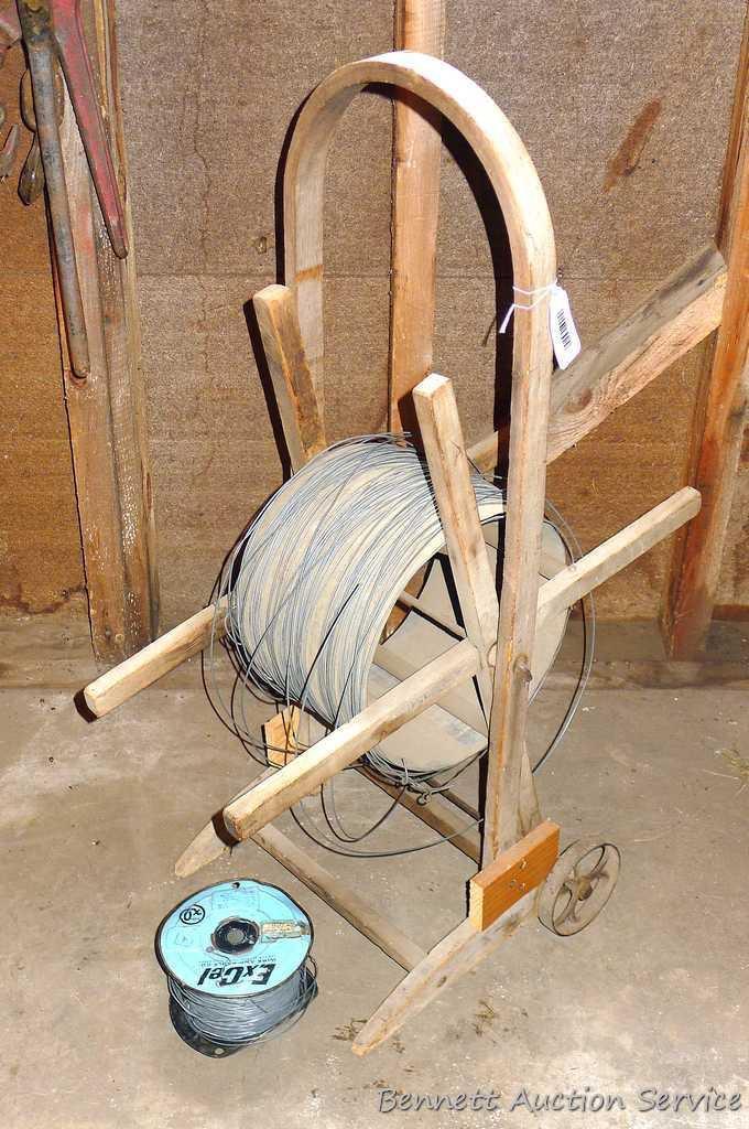 Cute little electric wire cart with partial spool of electric wire. Cart is 13" x 39" tall.