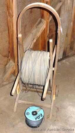 Cute little electric wire cart with partial spool of electric wire. Cart is 13" x 39" tall.