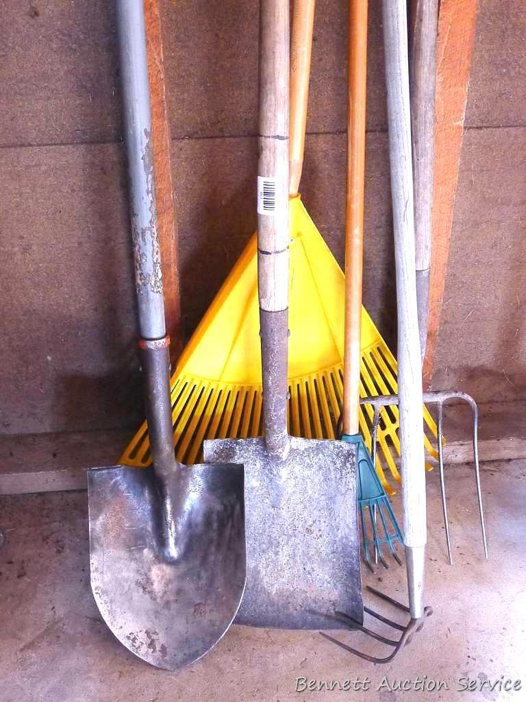 Hand tools including four prong metal fork; spaded shovel with fiberglass handle, flat shovel, hay