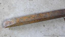 Heavy duty pry bar is 65" long and appear in nice condition.