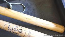 Two wooden tire knockers, approx. 22" long. Plastic tray is 14" x 19" x 2". One club is stamped