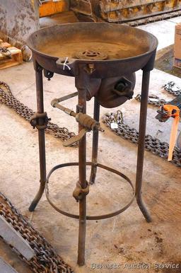 Cast iron blacksmith's forge is 18" diameter and stands 33" tall. Blower had been driven by a flat