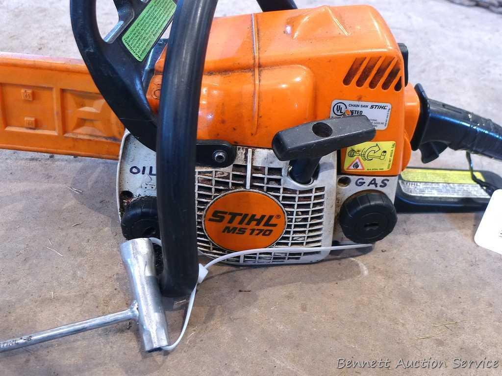 Stihl MS 170 chainsaw with 16" bar, bar cover, manual and wrench. Grip safety was wrapped with tape
