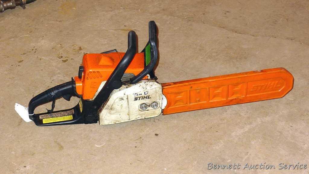 Stihl MS 170 chainsaw with 16" bar, bar cover, manual and wrench. Grip safety was wrapped with tape