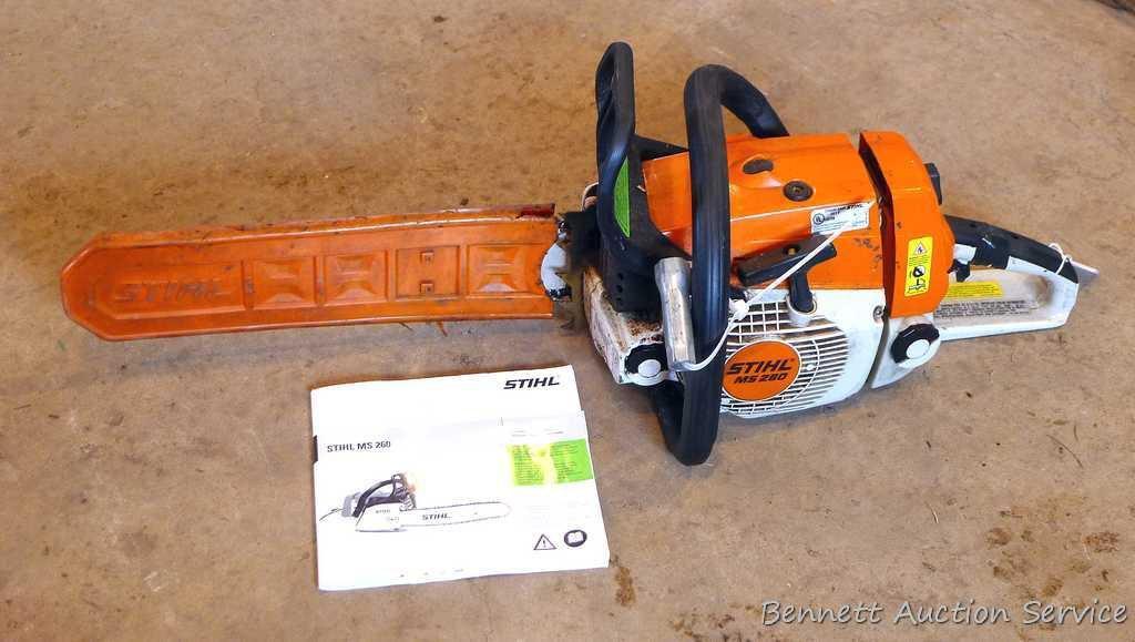 Stihl MS 260 chainsaw with 16" bar, bar cover, manual and wrench. Grip safety was wrapped with tape