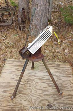 Free standing clay pigeon thrower is mounted on approx. 4'x4' piece of plywood for stability. Bird