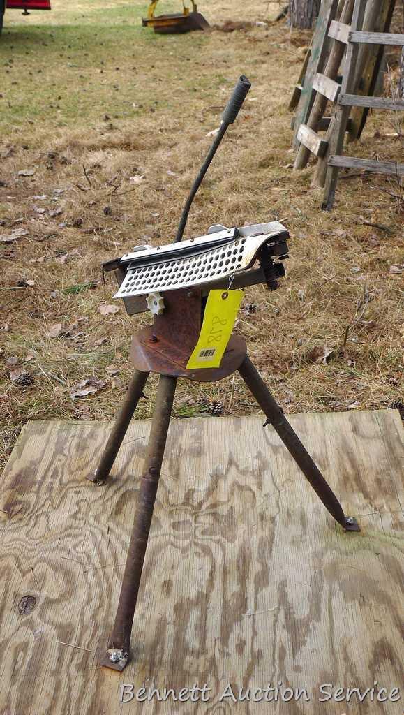 Free standing clay pigeon thrower is mounted on approx. 4'x4' piece of plywood for stability. Bird