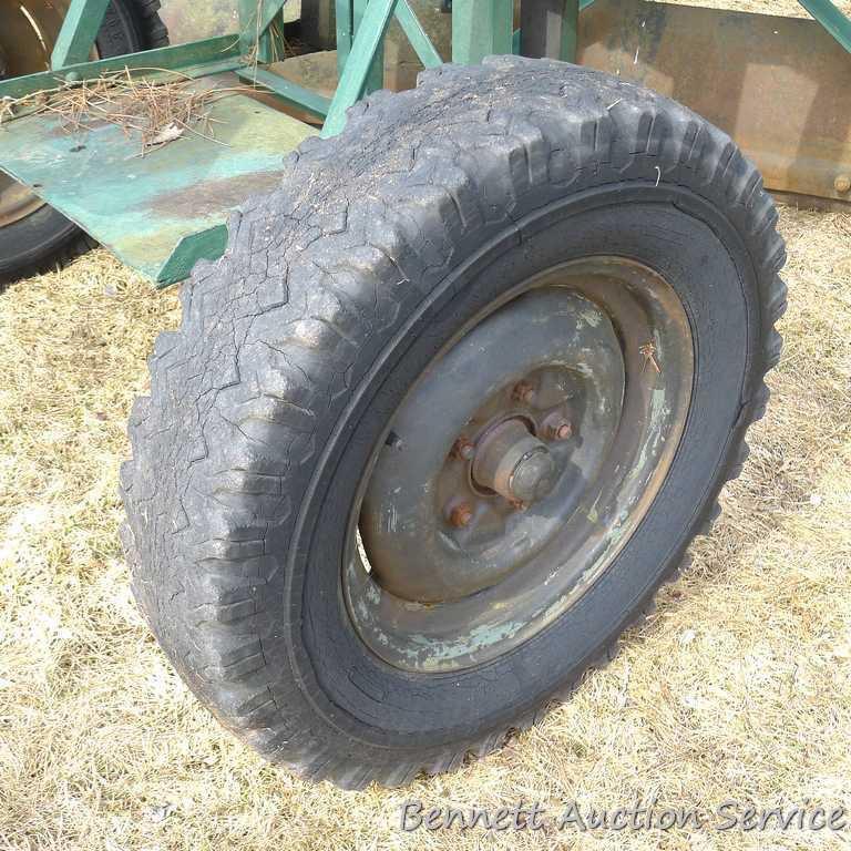 Pull behind road grader with 9' blade that swivels and tilts. Height and bevel adjustment works.